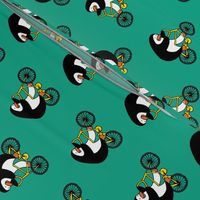 Penguins on bikes - Emerald