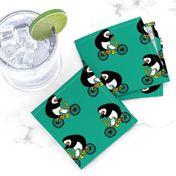 Penguins on bikes - Emerald