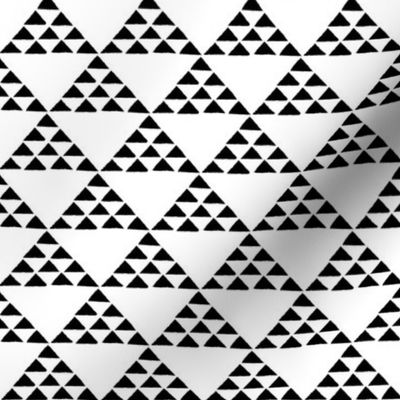 tiny black and white triangles that form larger triangles