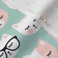 cat faces on dark mint