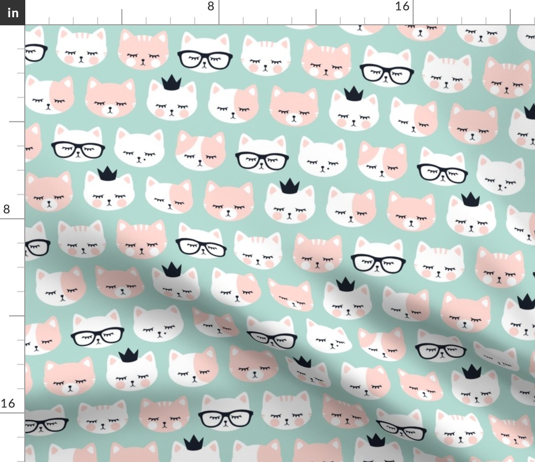 cat faces on dark mint