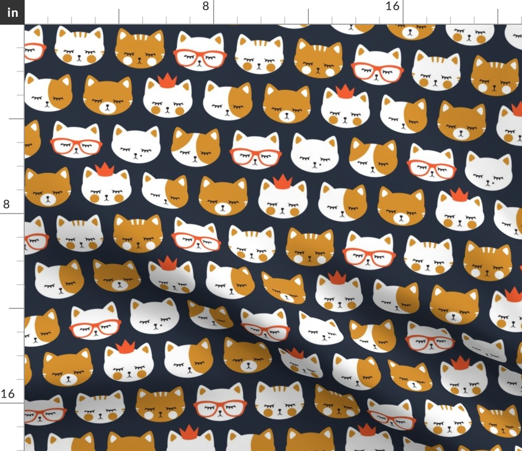 cat faces on dark blue