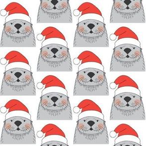grey otters with santa hats