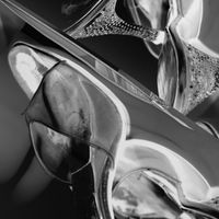 black and white negative of vintage lucite and rhinestone shoes