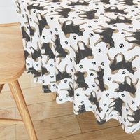 Trotting black and tan Shiba Inu and paw prints - white