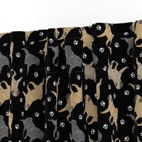 Trotting Pugs and paw prints - black