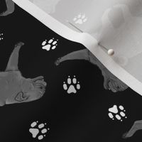 Trotting black Pugs and paw prints - black