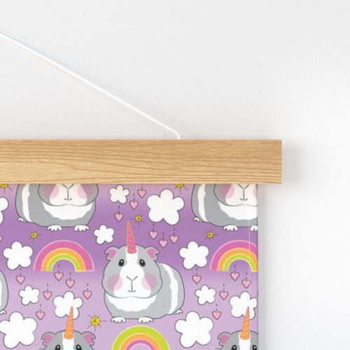 large unicorn guinea pigs and rainbows on purple