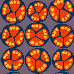 Fruit slices. Blue and orange tropical fruits with yellow seeds on a purple background. 