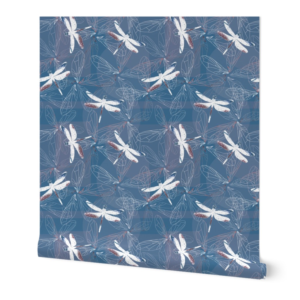 dragonfly silhouettes and wings on blue background