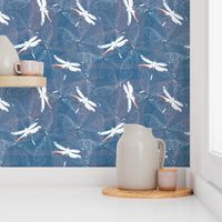 dragonfly silhouettes and wings on blue background