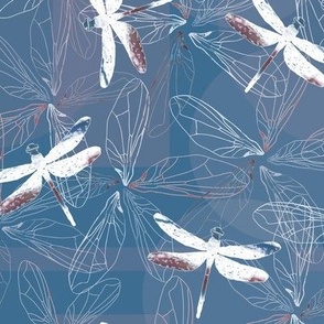 dragonfly silhouettes and wings on blue background