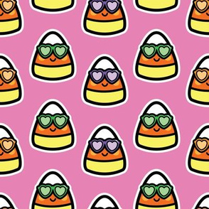 candy corn with sunglasses on pink