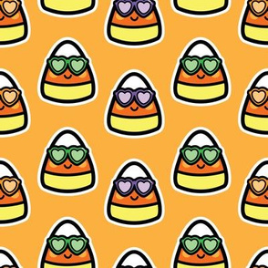 candy corn with sunglasses on orange