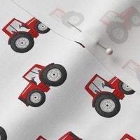 Rows of Red Tractors on white - small scale