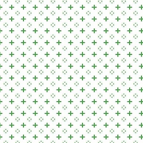 Ditsy print in a deep Christmas green on white