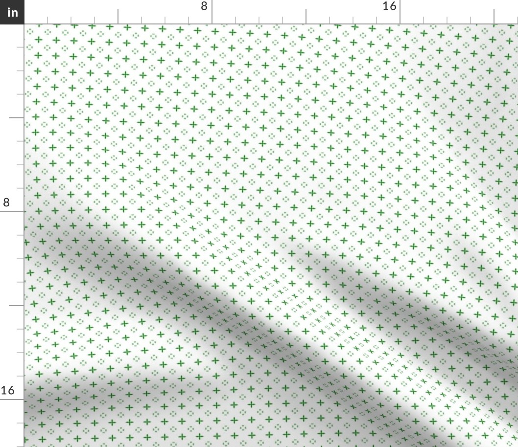 Ditsy print in a deep Christmas green on white