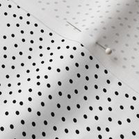 tiny black dots on white