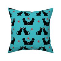 Retro black cat on turquoise with red starbursts