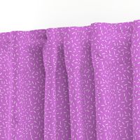 White Sprinkles on bright purple - tiny scale