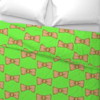 Tempo's  orange bow tie on green