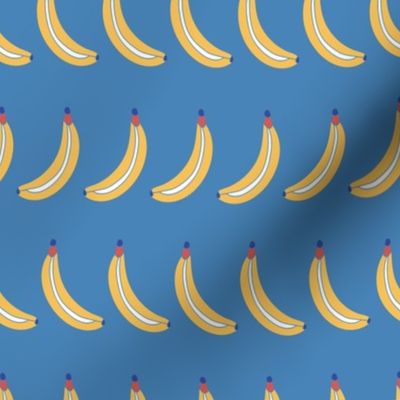 Bananas lined up on a blue background. Bananas in a row. Fruit pattern. 