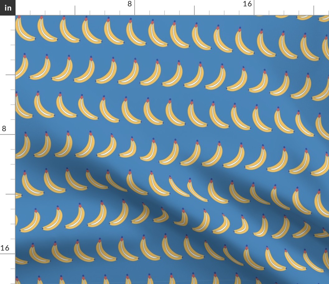 Bananas lined up on a blue background. Bananas in a row. Fruit pattern. 