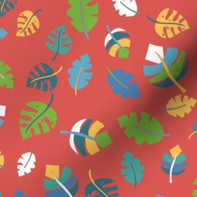 Tropical leaves on a red background. Green, blue, teal, yellow, and white leaves on red. Leaf pattern. Jungle leaves.