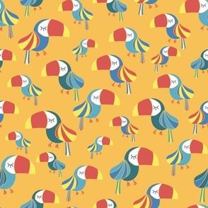 Toucans on a yellow background. Tropical bird pattern.