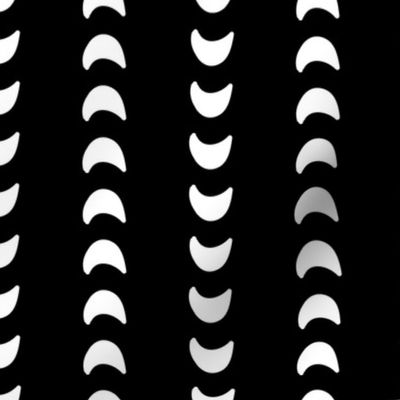 Abstract moon crescents white on black