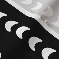 Abstract moon crescents white on black