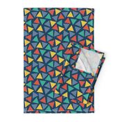 Red yellow blue teal turquoise triangles on a dark blue background. Scattered triangles. Randomly placed triangles. Geometric print. 