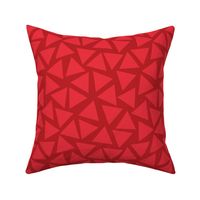 Red triangles randomly placed. Scattered light red triangles on a dark red background. Geometric pattern.