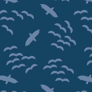 Flying birds. Bird silhouettes light blue on a dark blue background. Flock of birds. Swarm of birds. 