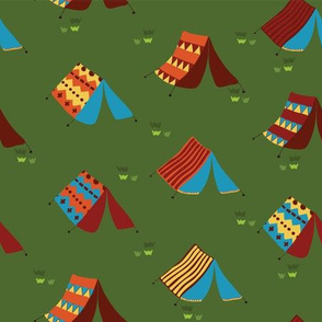Teepee tents on a meadow. Camping tents on a green background. Boho tent. Hippie tent. 