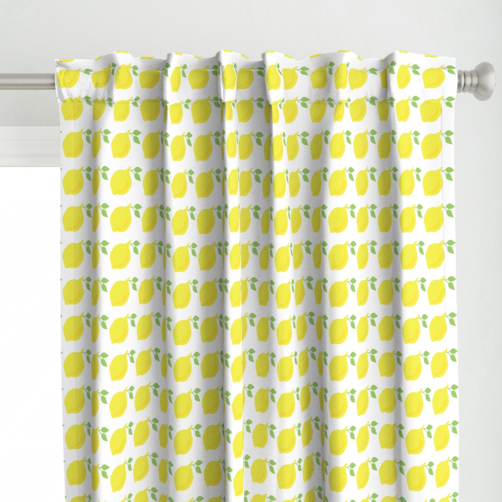 Lemons in a row on a white background. 