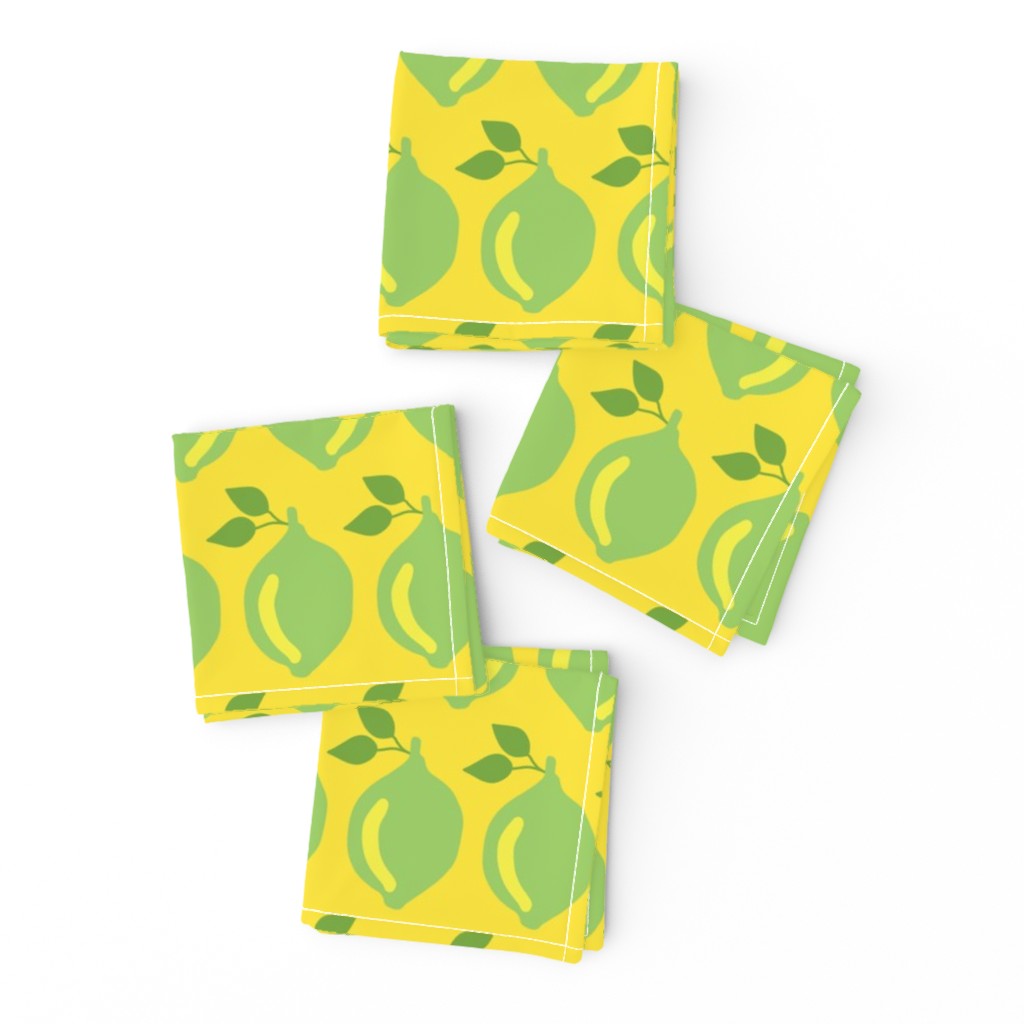 Limes in a row on a yellow background