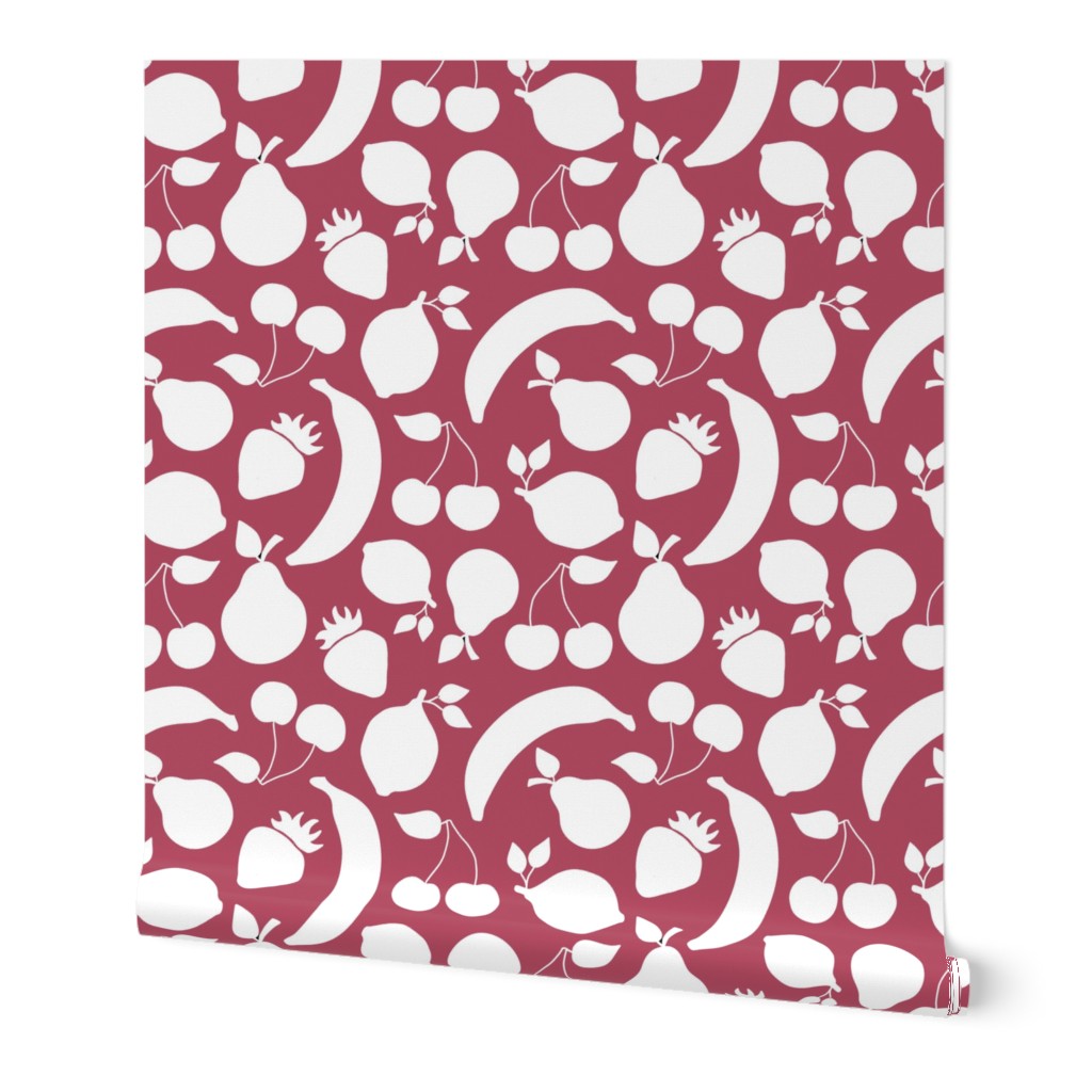 Fruit shapes on cherry red background