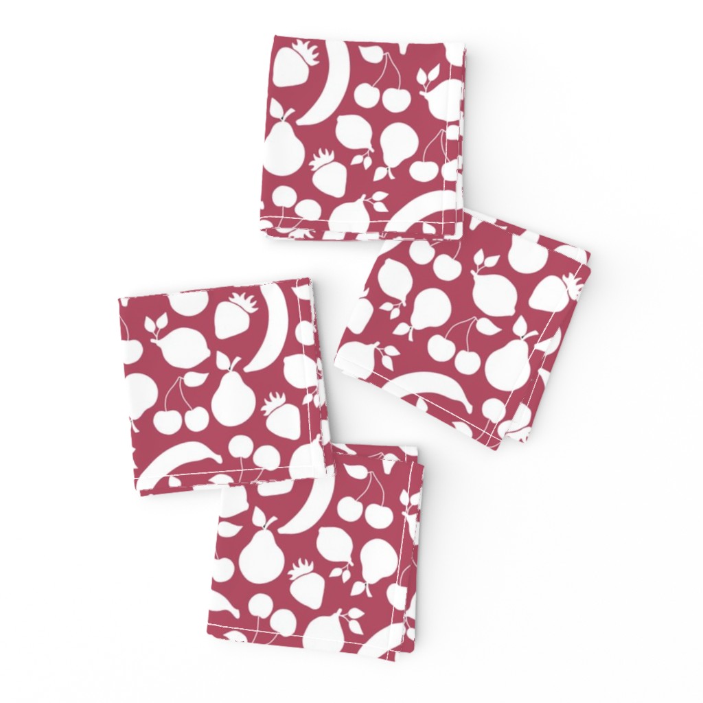 Fruit shapes on cherry red background