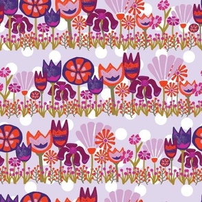 Tulips, Lily flowers, and Dianthus flowers in a row on a purple and white polka dot background