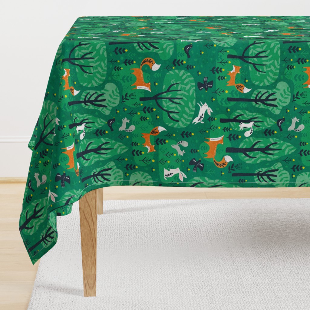 Foxes in the emerald forest in green