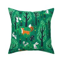 Foxes in the emerald forest in green