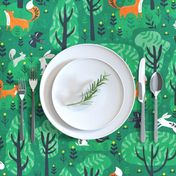 Foxes in the emerald forest in green