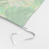 Watercolor green and yellow monstera leaves on light green background