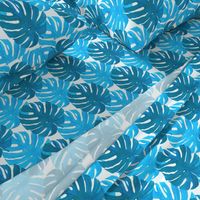 Watercolor blue and turquoise monstera leaves on white background