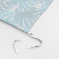 Watercolor blue and turquoise monstera leaves on white background