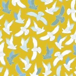 Snowy Owls In flight - white and grey on mustard yellow.