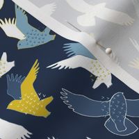 Snowy Owls In flight - blue and mustard