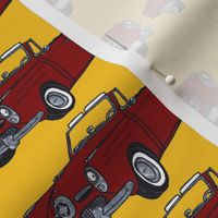 Red 1950 Studebaker convertible on yellow background