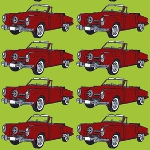 red 1950 Studebaker convertible on lime background